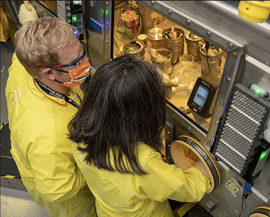 Workers conduct an analysis of plutonium at the Los Alamos National Laboratory in New Mexico where plutonium pits for nuclear weapons are manufactured. (Photo courtesy of Los Alamos National Laboratory)