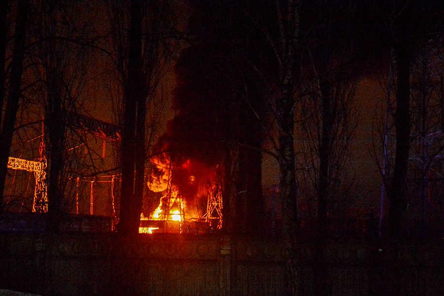 Part of a critical power infrastructure installation burns after a Russian drone attack near a residential building in Kyiv in December. (Photo by Aleksandr Gusev/SOPA Images/LightRocket via Getty Images)