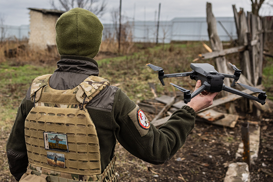 A Ukrainian soldier flies a drone on the outskirts of Bakhmut in eastern Ukraine in late December. (Photo by SAMEER AL-DOUMY/AFP via Getty Images)