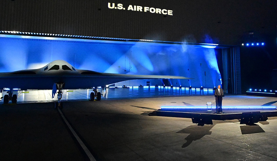 U.S. Defense Secretary Lloyd Austin speaks at the unveiling ceremony of the B-21 Raider at Northrop Grumman’s Air Force Plant 42 in Palmdale, California, in December. The high-tech stealth bomber can carry nuclear and conventional weapons and is designed to fly without a crew on board.  (Photo by Frederic J. Brown/AFP via Getty Images) 