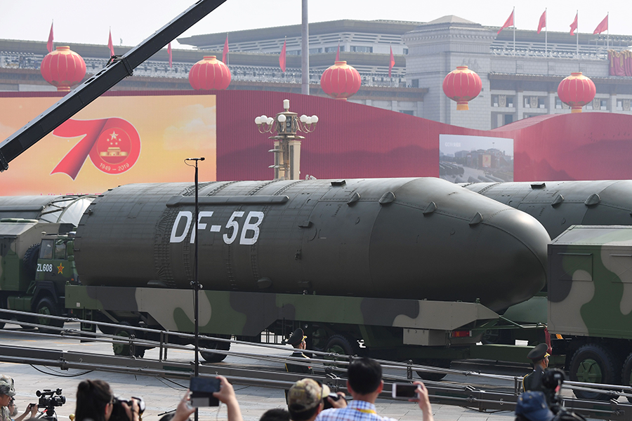 Chinese military vehicles carrying DF-5B intercontinental ballistic missiles participate in a military parade in Beijing’s Tiananmen Square in 2019. (Photo by Greg Baker/AFP via Getty Images)