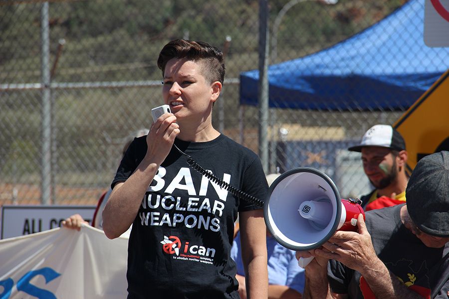 Ray Acheson, director of Reaching Critical Will, a disarmament program, speaks at an anti-nuclear weapons rally at U.S.-Australian Joint Military Base Pine Gap, in Australia in 2016. (Photo by Tim Wright/ICAN)