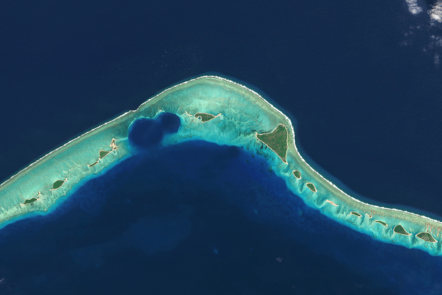 A satellite image of the craters caused by U.S. nuclear testing in 1946–1958 on Enewetak Atoll in the Marshall Islands. When well water was detected as radioactive in 1977, islanders were forced to leave. They are still unable to safely return.  (Photo by Gallo Images/Orbital Horizon/Copernicus Sentinel Data 2021 via Getty Images)