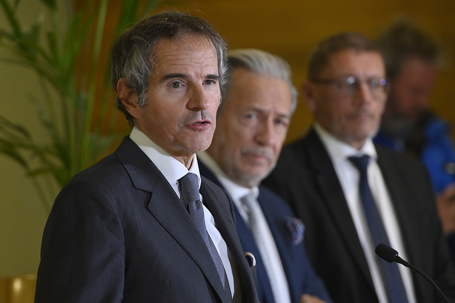 Rafael Mariano Grossi (L), director-general of the International Atomic Energy Agency (IAEA), and other IAEA officials address journalists in Vienna after meeting Iranian President Ebrahim Raisi, Iranian Foreign Minister Hossein Amirabdollahian and, Mohammad Eslami, Head of the Atomic Energy Organization of Iran (AEOI), during a two day visit to Tehran. (Photo by Dean Calma / IAEA)