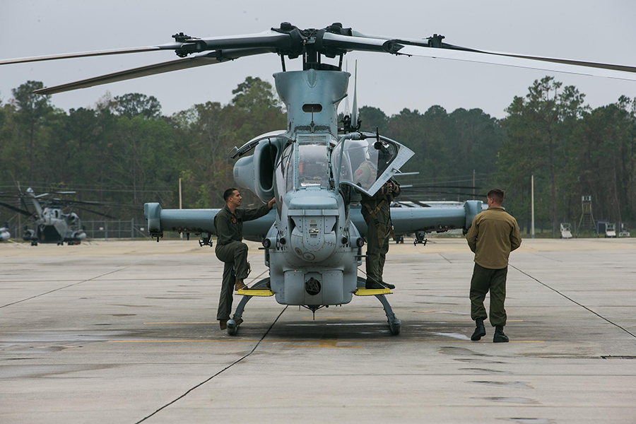 U.S. Marines conduct post-flight inspections on an AH-1Z Viper attack helicopter at Marine Corps Air Station New River, North Carolina. A Biden administration decision to approve the sale of a version of the helicopter to Nigeria has been controversial because of the country’s human rights record. (U.S. Marine Corps photo by Cpl. Jered T. Stone)