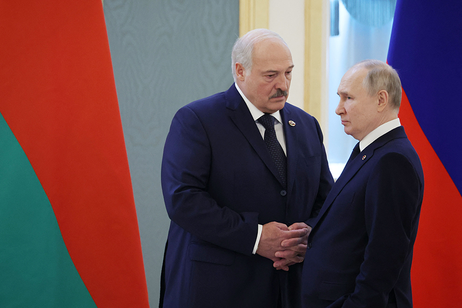 Russian President Vladimir Putin (R) and Belarusian President Alexander Lukashenko confer at the Kremlin in Moscow on April 6. (Photo by Mikhail Klimentyev/Sputnik/AFP via Getty Images)