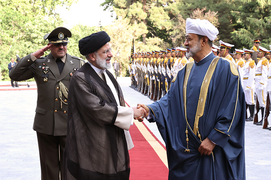 Haitham bin Tariq (R), sultan of Oman, is welcomed by Iranian President Ebrahim Raisi (C) in Tehran on May 28. Two weeks later, an Iranian spokesperson confirmed that Iranian and U.S. officials held proximity talks in Oman in May. (Photo by Iranian Presidency / Handout/Anadolu Agency via Getty Images)