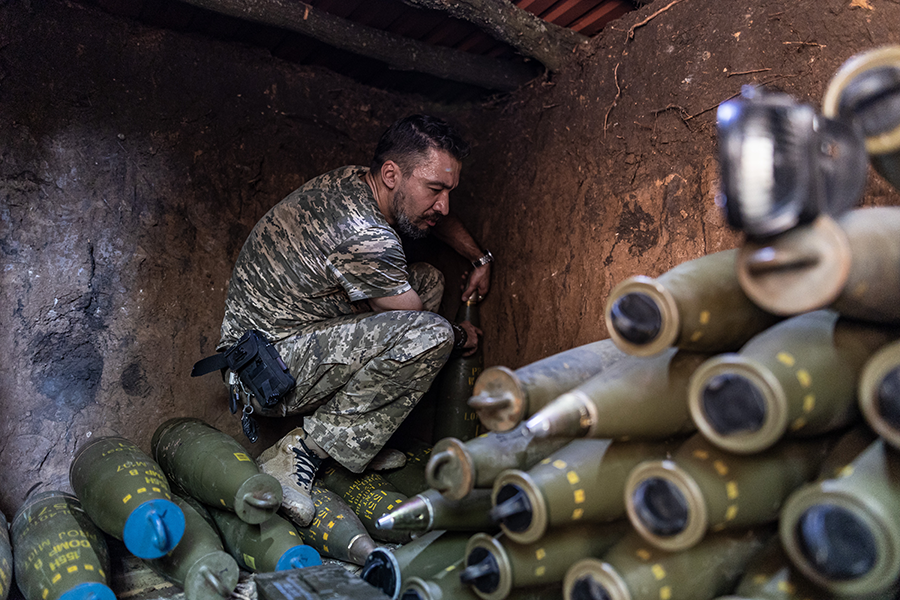 A Ukrainian soldier prepares 155mm artillery shells as the Ukrainian Army conducts an operation targeting the trenches of Russian forces in August in the Donetsk Oblast during the Russian war on Ukraine. (Photo by Diego Herrera Carcedo/Anadolu Agency via Getty Images)