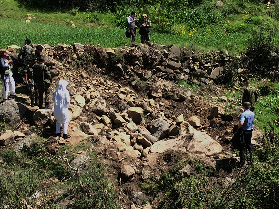A bomb crater in a meadow in Balakot, a remote area of Pakistan, was left behind after an Indian fighter jet in 2019 attempted to strike a mountaintop building that New Delhi said was a militant training camp. (Photo by Pamela Constable/The Washington Post via Getty Images)