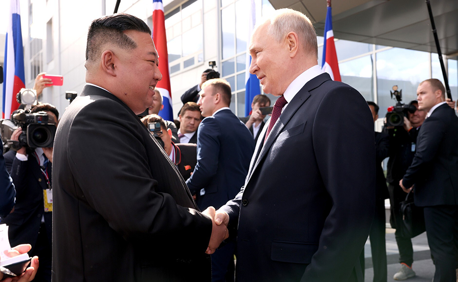 Russian President Vladimir Putin (R) shakes hand with North Korean leader Kim Jong Un before they inspect the spaceport Vostochny Cosmodrome in Russia's Amur region on Sept. 13. Kim says that relations with Russia are “the very first priority” for his country. (Photo by Kremlin Press Office / Handout/Anadolu Agency via Getty Images)