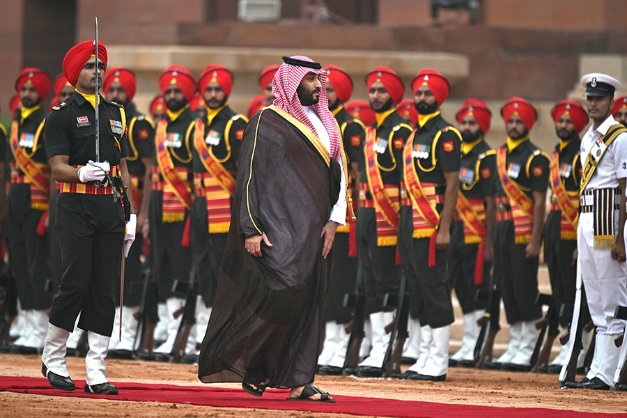 Crown Prince Mohammed bin Salman of Saudi Arabia (C), inspecting an honor guard during the G20 summit in New Delhi in September, says that if Iran acquires a nuclear weapon, “we have to get one.” (Photo by Money Sharma/AFP via Getty Images)