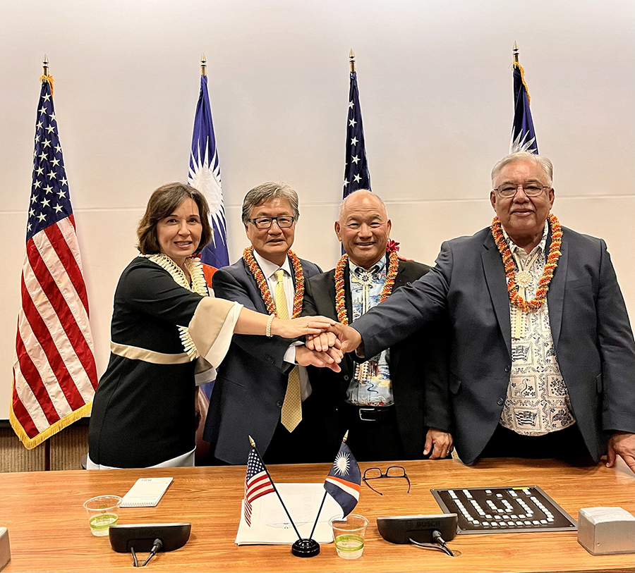 After months of difficult negotiations, the United States and the Marshall Islands signed a new Compact of Free Association governing their relationship. At the ceremony in October are, from left, Carmen Cantor, U.S. assistant secretary of the interior for insular affairs; Joseph Yun, U.S. negotiator for the compact; Jack Ading, the Marshall Islands trade and foreign affairs minister; and Phillip Muller, the Marshall Islands chief negotiator. (Photo courtesy of The Republic of the Marshall Islands Port Authority)