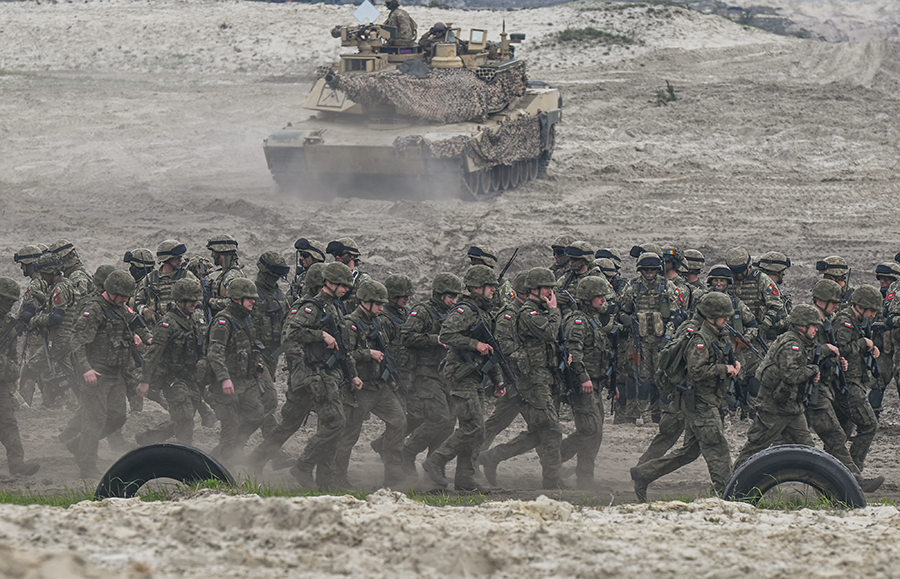 Polish army soldiers undergoing high-intensity training session at the Nowa Deba training ground in Poland in May. The exercises include collaboration with forces from Romania, Slovenia and the United States. (Photo by Artur Widak/NurPhoto via Getty Images)