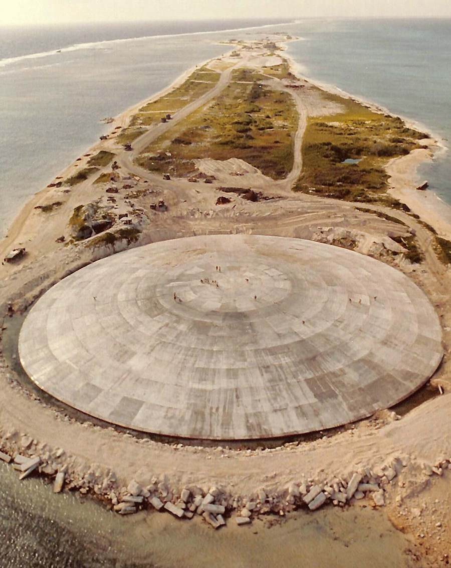 Runit Dome, on Runit Island in Enewetak Atoll in the South Pacific, covers a pit used to bury 84,000 cubic meters of radioactive soil scraped from various contaminated islands in the region, where U.S. nuclear weapons tests took place between 1948 and 1958.  (Photo by U.S. Defense Special Weapons Agency via Wikimedia)
