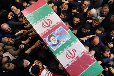 Iranians attend a funeral for the late President Ebrahim Raisi at Tehran University in Tehran on May 22. Raisi and other officials were killed in a helicopter crash three days earlier. (Photo by Iranian Leader Press Office/Handout/Anadolu via Getty Images)