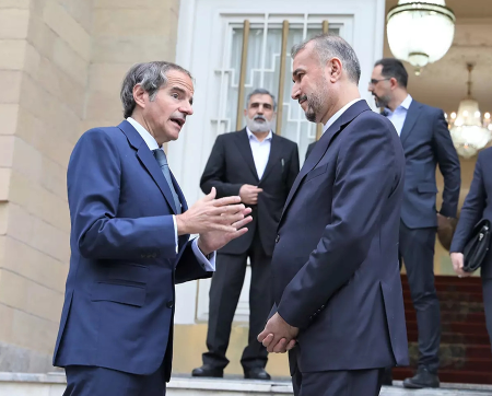 Rafael Mariano Grossi, director-general of the International Atomic Energy Agency, (L) meets Iranian Foreign Minister Hossein Amirabdollahian in Tehran on May 6 to discuss enhancing the monitoring of Iran’s nuclear program. Amirabdollahian’s death in a helicopter crash with President Ebrahim Raisi on May 19 further delayed engagement between Tehran and the agency. (Photo by Iranian Ministry of Foreign Affairs/Anadolu via Getty Images)