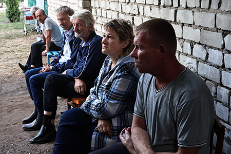 Civilian residents sit near a bomb shelter in the Kursk region of Russia on August 16, 10 days after Ukrainian military forces crossed the Russian-Ukrainian border near the city of Sudzha and began to advance deep into Russian territory. (Photo by Yan Dobronosov/Global Images Ukraine via Getty Images)