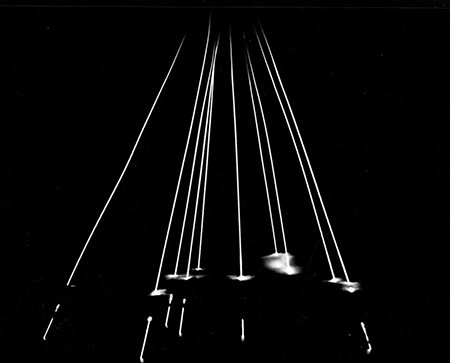 Time exposure of 10 dummy warheads from a test MX missile, white hot from atmospheric friction, reentering through a cloud at night over Kwajalein Atoll 5,000 miles downrange. The launch took place April 24, 2008, from Vandenberg Air force Base. (Photo courtesy of U.S. Department of Defense)