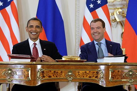 It was all smiles in 2010 as U.S. President Barack Obama (L) and his Russian counterpart, Dmitry Medvedev, sign the New Strategic Arms Reduction Treaty (New START), committing the two nations to major cuts in deployed warheads and delivery vehicles, in Prague on April 8, 2010. The pact expires on February 5, 2026, when the two sides will be free to expand their arsenals. (Photo by Dmitry Astakhov/Ria Novosti/AFP via Getty Images)