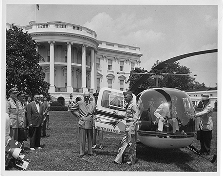 U.S. Navy Captain Evan Aurand (L) holds an an early version of the president’s emergency satchel, later known as the nuclear football, as he accompanies President Dwight Eisenhower (C, with hand on hip) on the White House lawn during Operation Alert, a civil defense exercise, on July 12, 1957. (Photo courtesy of the Dwight D. Eisenhower Presidential Library)