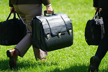 The nuclear football, which goes wherever the U.S. president goes, contains the launch codes for nuclear weapons, communications gear, and options for a nuclear strike; it weighs about 45 pounds. (Photo by Andrew Leyden/NurPhoto via Getty Images)