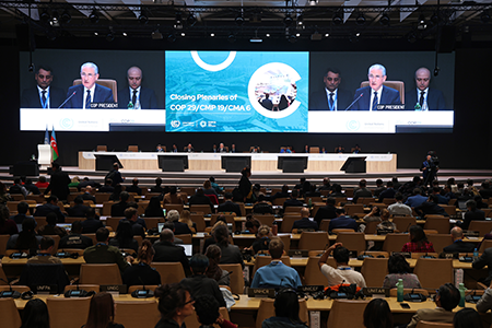 Delegates to the COP29 Climate Conference in Baku, Azerbaijan, in November made progress discussing the global carbon market architecture, a governance model that could be applicable to AI in dealing with weapons of mass destruction risks. (Photo by Sean Gallup/Getty Images)