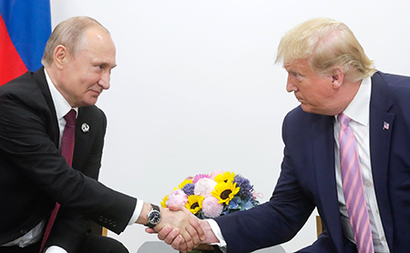 U.S. President Donald Trump’s (R) growing preference for Russian President Vladimir Putin is unnerving U.S. allies and shaking geopolitics. The two men were photographed in 2019 at the Group of 20 summit in Osaka. (Photo by Kremlin Press Office / Handout/Anadolu Agency/Getty Images)
