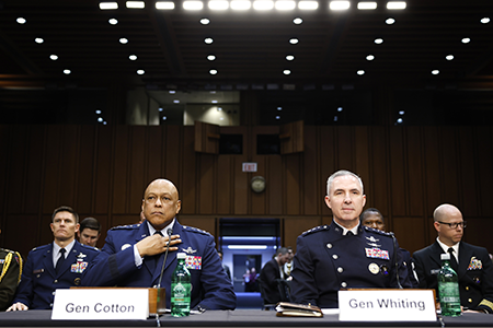 U. S. Strategic Command chief Gen. Anthony Cotton (L), seen testifying before the Senate Armed Services Committee in February, is advocating buying 145 B-21 nuclear-capable strategic bombers for the service instead of a planned 100 planes. Space Force Gen. Stephen Whiting sits on Cotton’s right. (Photo by Anna Moneymaker/Getty Images)