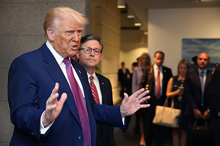 U.S. President Donald Trump (L), with House Speaker Mike Johnson (R-LA) by his side, speaks to the press while visiting the U.S. Capitol May 20 to lobby for the Republican budget bill. (Photo by Tasos Katopodis/Getty Images)