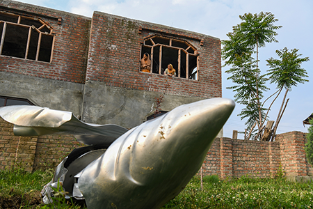 The wreckage of an unidentified aircraft lays on the ground in Kashmir. India launched airstrikes on Pakistan and Pakistan-administered Kashmir May 7 after a terrorist attack April 22 killed 26 people in the Kashmiri town of Pahalgam. The attack, which India blamed on Pakistan, triggered a three-week crisis of expansive air strikes between the nuclear rivals.  (Photo by Basit Zargar/Middle east images/AFP via Getty Images)