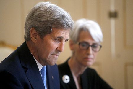 U.S. Secretary of State John Kerry (L) and U.S. Undersecretary for Political Affairs Wendy Sherman at the start of a meeting June 30, 2015 with Iranian Foreign Minister Javad Zarif (not shown) and other members of the Iranian delegation as the teams press ahead with efforts to seal a historic nuclear deal with Iran. (Photo by Carlos Barria/AFP via Getty Images)