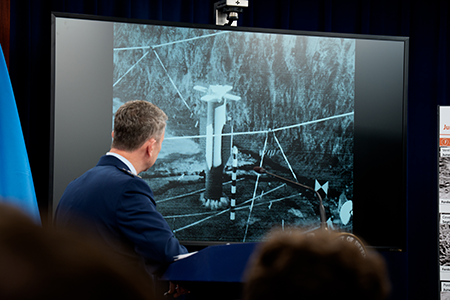 U.S. Chairman of the Joint Chiefs of Staff Air Force Gen. Dan Caine and Defense Secretary Pete Hegseth (not shown) hold a press conference June 26 after the United States bombed three Iranian nuclear facilities.  They also showed a video of a bombing test of the GBU-57A/B Massive Ordnance Penetrator, which was used in the attack on the Iranian Fordow uranium enrichment plant. (Photo by Andrew Harnik/Getty Images)