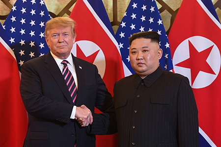 U.S. President Donald Trump (L) shakes hands with North Korean leader Kim Jong Un before their meeting in Hanoi on February 27, 2019. (Photo by Saul Loeb/AFP via Getty Images)