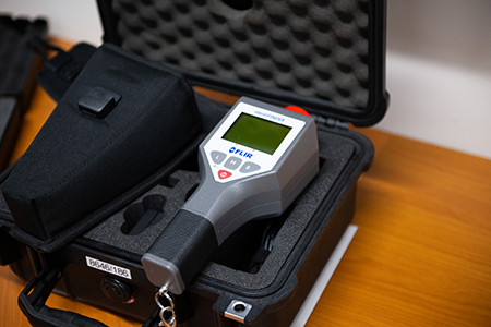 A handheld monitoring system for verifying the presence of uranium, plutonium and other isotopes is among the tools that have allowed international monitors to ensure that nuclear arms control agreements are being adhered to. Comparable mechanisms will be needed to verify that nuclear-related AI commitments are also implemented. (Photo by Thomas Kronsteiner/Getty Images)