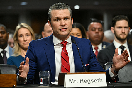 U.S. Defense Secretary Pete Hegseth, seen testifying at his Senate confirmation hearing in January, is reforming how the Pentagon acquires weapons systems by loosening restrictions on defense contractors and emphasizing speed over other requirements, promising a transformational improvement.  (Photo by Saul Loeb/AFP via Getty Images)