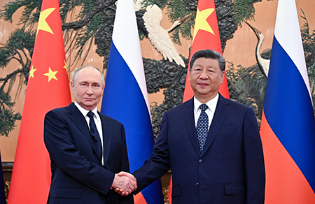 Russian President Vladimir Putin (L) meets Chinese President Xi Jinping at The Great Hall of the People in Beijing on September 2, 2025. Some U.S. analysts see their growing partnership as a coordinated threat but contributor Georgi Ivanov disagrees.  (Photo by Sergey Bobylev/POOL/AFP via Getty Images)