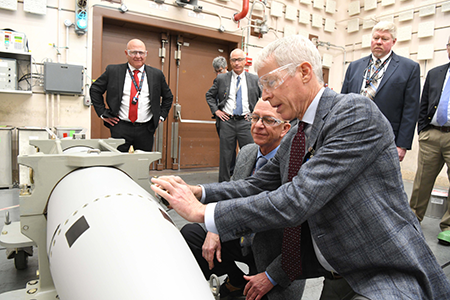 U.S. Secretary of Energy Chris Wright in May 2025 stamps the first B61-13 unit, the latest version of the B61 earth-penetrating bunker-busting bomb. Congress recently adopted a defense budget for fiscal year 2026 that includes $57 million for a prototype of a new nuclear weapon delivery system that is the next iteration of the bomb aimed at destroying hard and deeply buried targets. (Photo by U.S. Department of Energy).