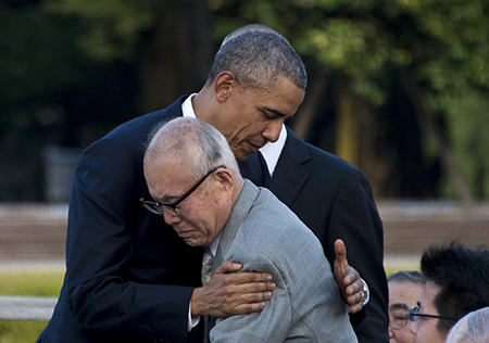 U.S. President Barack Obama hugs Shigeaki Mori (front), a survivor of the 1945 atomic bombing of Hiroshima, during a visit to the Hiroshima Peace Memorial Park May 27, 2016.   (Photo by Jim Watson/AFP via Getty Images)