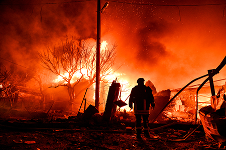 Russia’s war in Ukraine is expected to be a divisive issue when states-parties to the nuclear Nonproliferation Treaty hold their 11th review conference in New York, starting April 27. In this March 16 photo, residential houses are on fire after a Russian drone attack on Zaporizhzhia, Ukraine. (Photo by Dmytro Smolienko/ Ukrinform/Future Publishing via Getty Images)