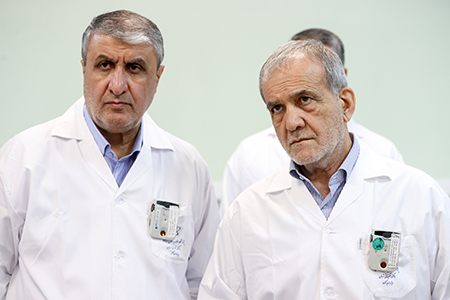 Iranian President Masoud Pezeshkian (R) and Mohammad Eslami, head of the Atomic Energy Organization of Iran (L), visits nuclear facilities in Tehran November 1, 2025. Pezeshkian says Iran would rebuild the nuclear facilities targeted by the United States, according to IRNA, the state-run news agency. (Photo by Iranian Presidency/Handout/Anadolu via Getty Images)