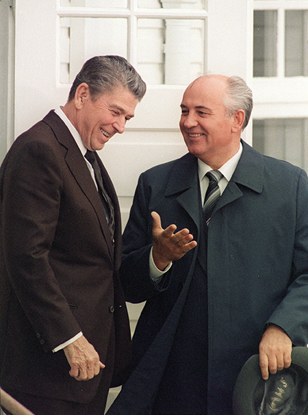 U.S. President Ronald Reagan (L) and Soviet leader Mikhail Gorbachev share a light moment October 11, 1986, outside Hofdi House in Reykjavik, Iceland, prior to their first round of talks. The summit produced no concrete outcome but it did energize bilateral arms control negotiations. (Photo by Mike Sargent/AFP via Getty Images)