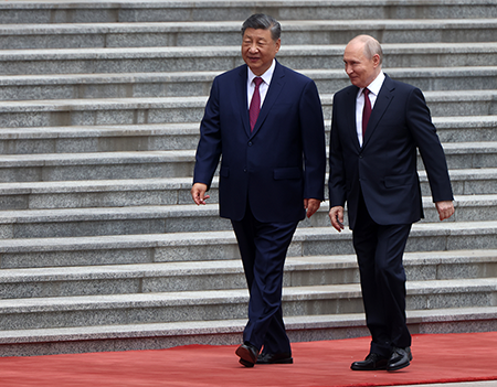 Chinese President Xi Jinping (L) and Russian President Vladimir Putin attend a welcoming ceremony May 20 at the start of Putin’s visit to Beijing. A growing closeness between their two countries worries many U.S. officials and analysts. (Photo by Contributor/Getty Images)
