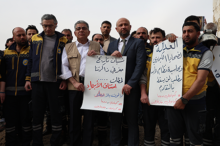 Syrians gather during a memorial ceremony in 2025 to commemorate the victims of the chemical weapons attack by Assad regime forces in 2018, in Douma, Eastern Ghouta, Syria. The UN recently announced the discovery of a cache of weapons, including rockets, similar to those used in the sarin gas attack that killed roughly 1,400 people in Ghouta. (Photo by Hamza Abbas/Anadolu via Getty Images)