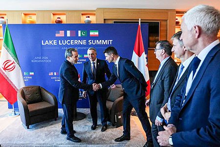 Iranian Foreign Minister Abbas Araghchi (L) meets his Swiss counterpart Ignazio Cassis (R) in Bürgenstock, Switzerland, June 21 to discuss the implementation of an Iranian-U.S. memorandum of understanding aimed at ending fighting in the Gulf and reaching a nuclear deal. (Photo by Iranian Foreign Ministry / Handout/Anadolu via Getty Images)