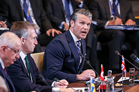 U.S. Secretary of Defense Pete Hegseth (R) addresses NATO defense ministers’ June 18 at alliance headquarters in Brussels, where he announced that Washington will conduct a six-month review of U.S. basing and force posture in Europe.  (Photo by Omar Havana/Getty Images)