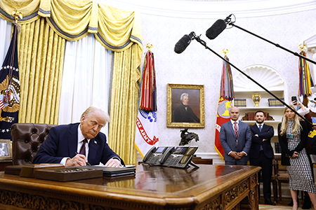 Soon after taking office in January 2025, U.S. President Donald Trump signs an executive order enjoining senior administration officials to terminate all measures adopted by his predecessor to regulate advanced AI models. (Photo by Anna Moneymaker/Getty Images)