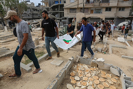 A mass funeral is held for 50 Palestinians killed in the Israel-Hamas war Sept. 29 in Nuseirat, Gaza. Despite international outrage over Israel’s military attacks on Gaza and Lebanon, the Trump administration plans to sell Israel another $2.8 billion in weapons, including 40,000 one-ton bombs. (Photo by Ahmad Hasaballah/Getty Images)