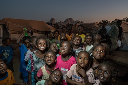 Children at the Omar Haj Musa internally-displaced persons site in eastern Sudan. The site is home to hundreds of families, displaced from cities south of Khartoum as fighting between the government and opposition Rapid Support Forces spread between late 2023 and 2024.  (Photo by Giles Clarke/UNOCHA via Getty Images)