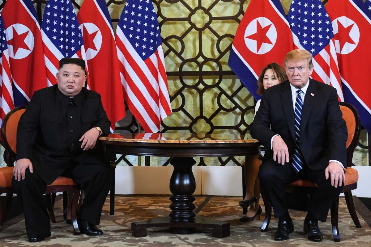 US President Donald Trump (R) and North Korea's leader Kim Jong Un hold a meeting during the second US-North Korea summit at the Sofitel Legend Metropole hotel in Hanoi on February 28, 2019. (Photo by Saul LOEB / AFP)