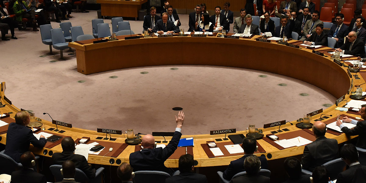 The UN Security Council votes to extend investigations into who is responsible for chemical weapons attacks in Syria at the United Nations on October 24, 2017. Russian Ambassador to the UN Vassily Nebenzia(raising his hand) voted no to the resolution. (Photo: TIMOTHY A. CLARY/AFP/Getty Images)